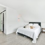 A beautiful modern bedroom in white colors